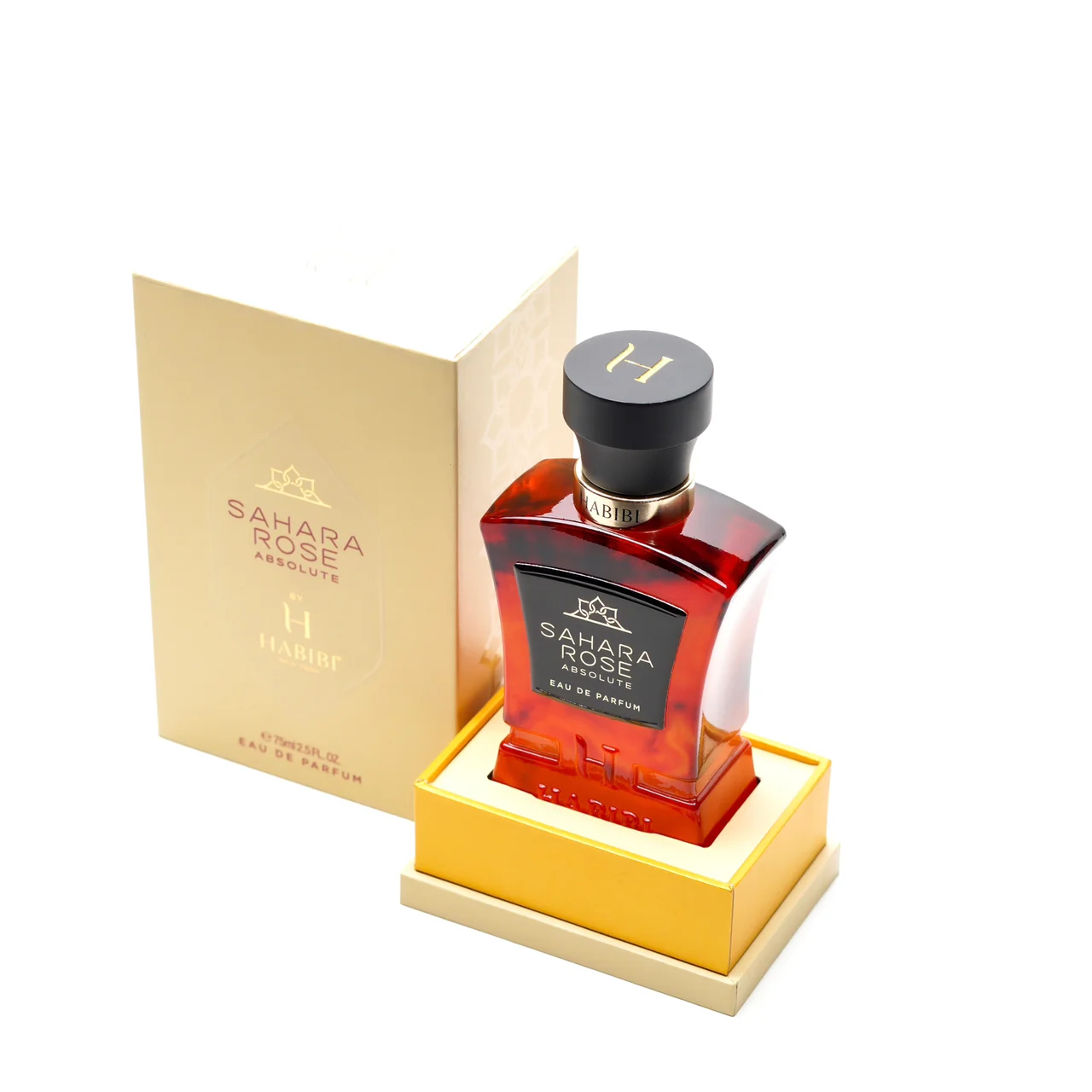 A perfume bottle labeled 'Sahara Rose Absolute' with its box.
