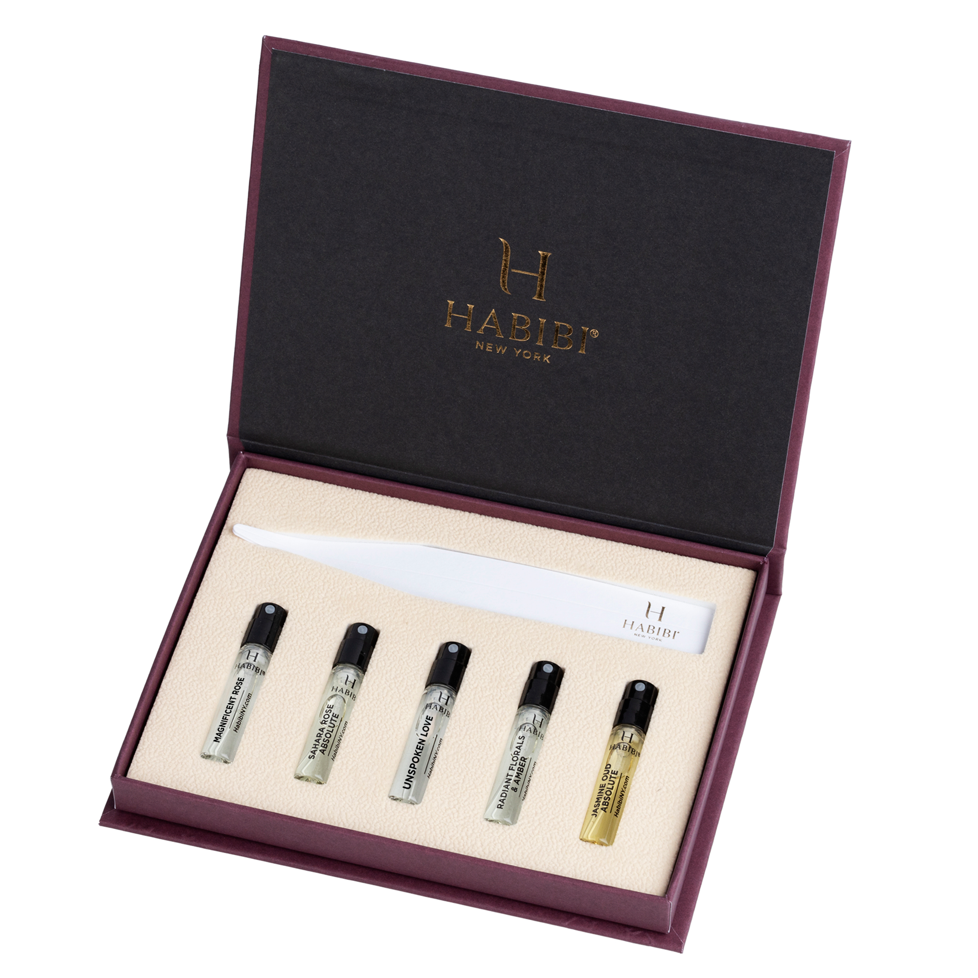 A perfume sample set with five small vials and a paper scent strip.