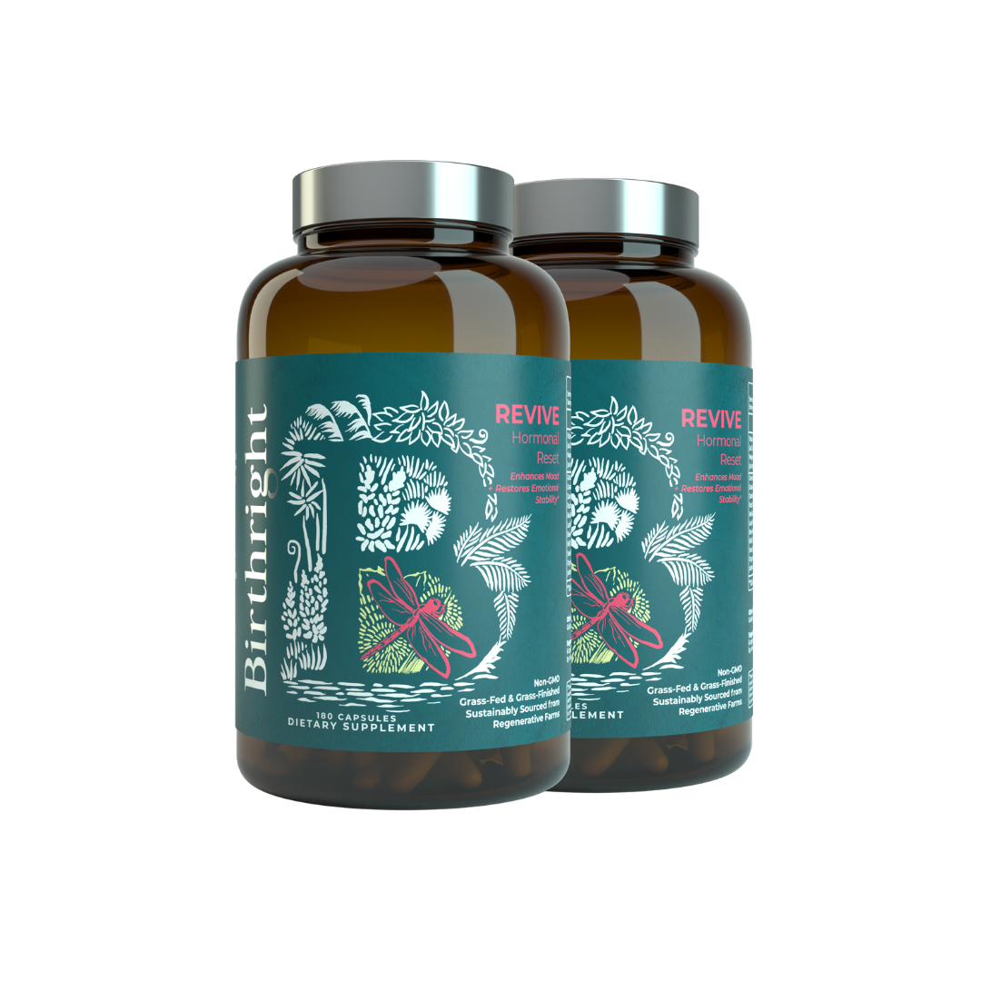 Two brown bottles labeled 'Birthright Revive Hormonal Reset' with decorative botanical designs.