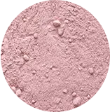 Pink powder with a rough texture in a circular shape.