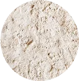 Close-up of a textured, light-colored powder in a circular frame.