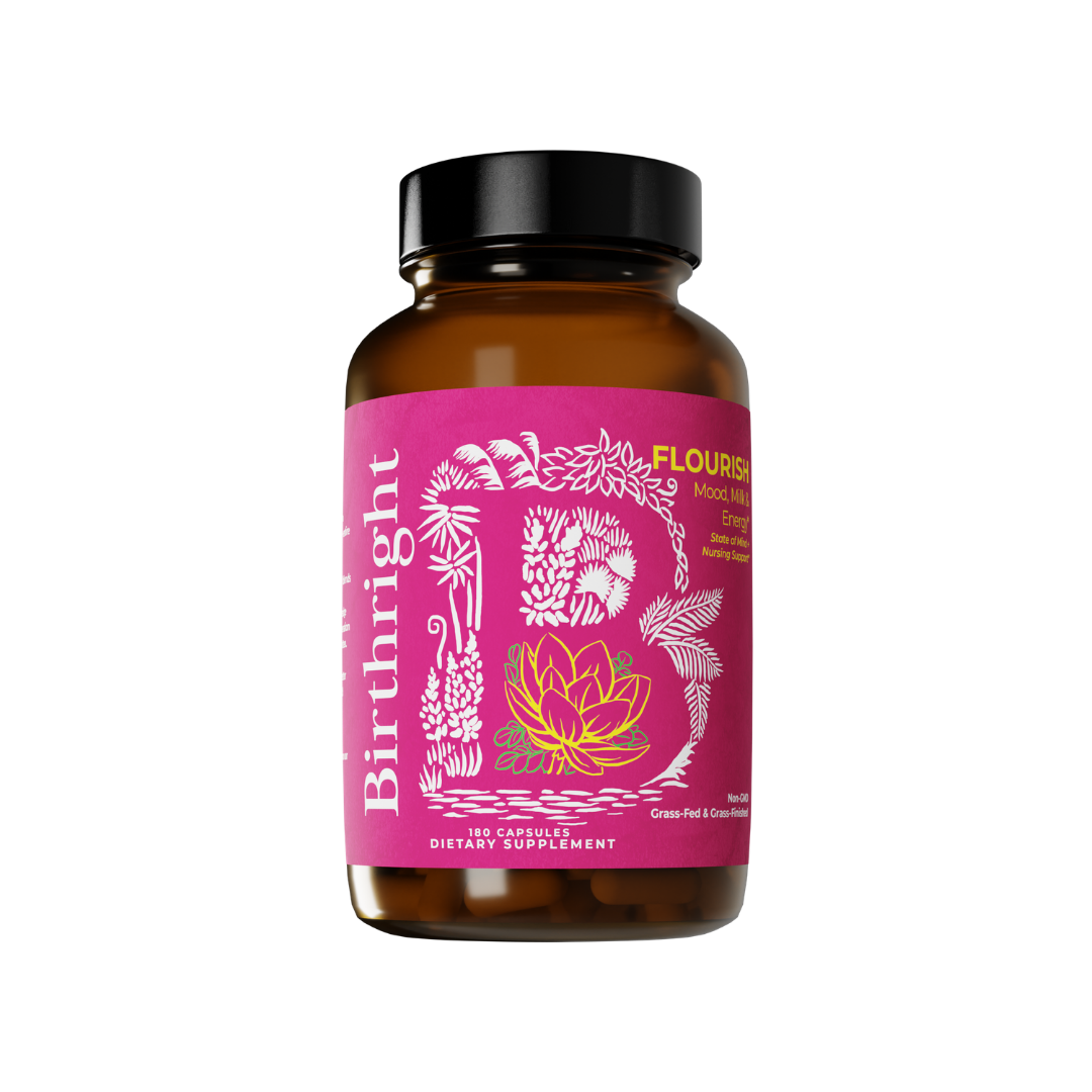 A brown glass bottle of Birthright Flourish dietary supplement capsules with a pink floral-illustrated label.