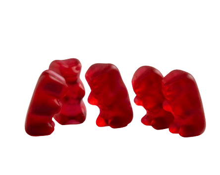 A group of five red gummy bears against a plain white background.