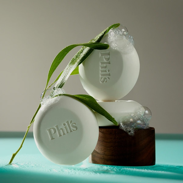 Bars of Phil's soap with leaves and bubbles.
