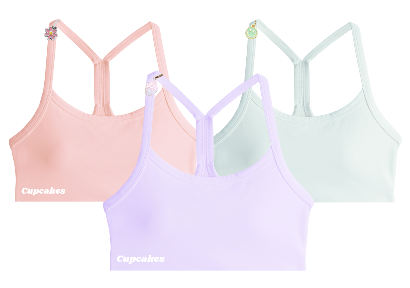 Three pastel-colored sports bras with decorative charms on straps.