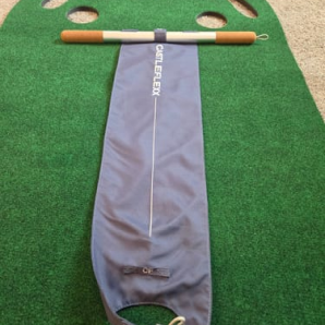 Customer photo of a gray CastleFlexx strap laid out on a green mat