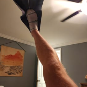 Customer photo of a raised leg stretching in a CastleFlexx strap