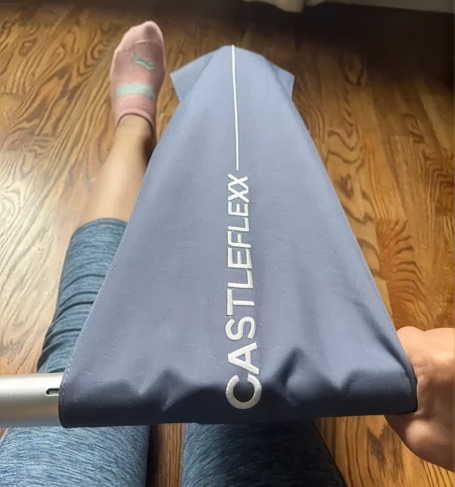 Foot resting in the CastleFlexx foot hammock with the heel in the hole and toes pulled back into a stretch