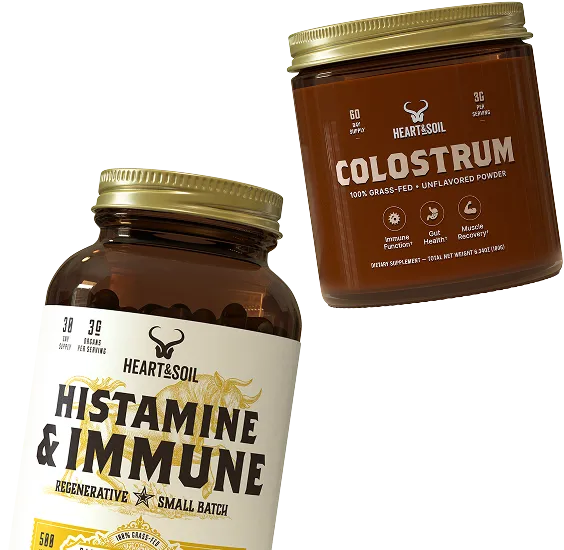 A jar of Heart & Soil Colostrum powder and a bottle of Histamine & Immune supplement capsules.