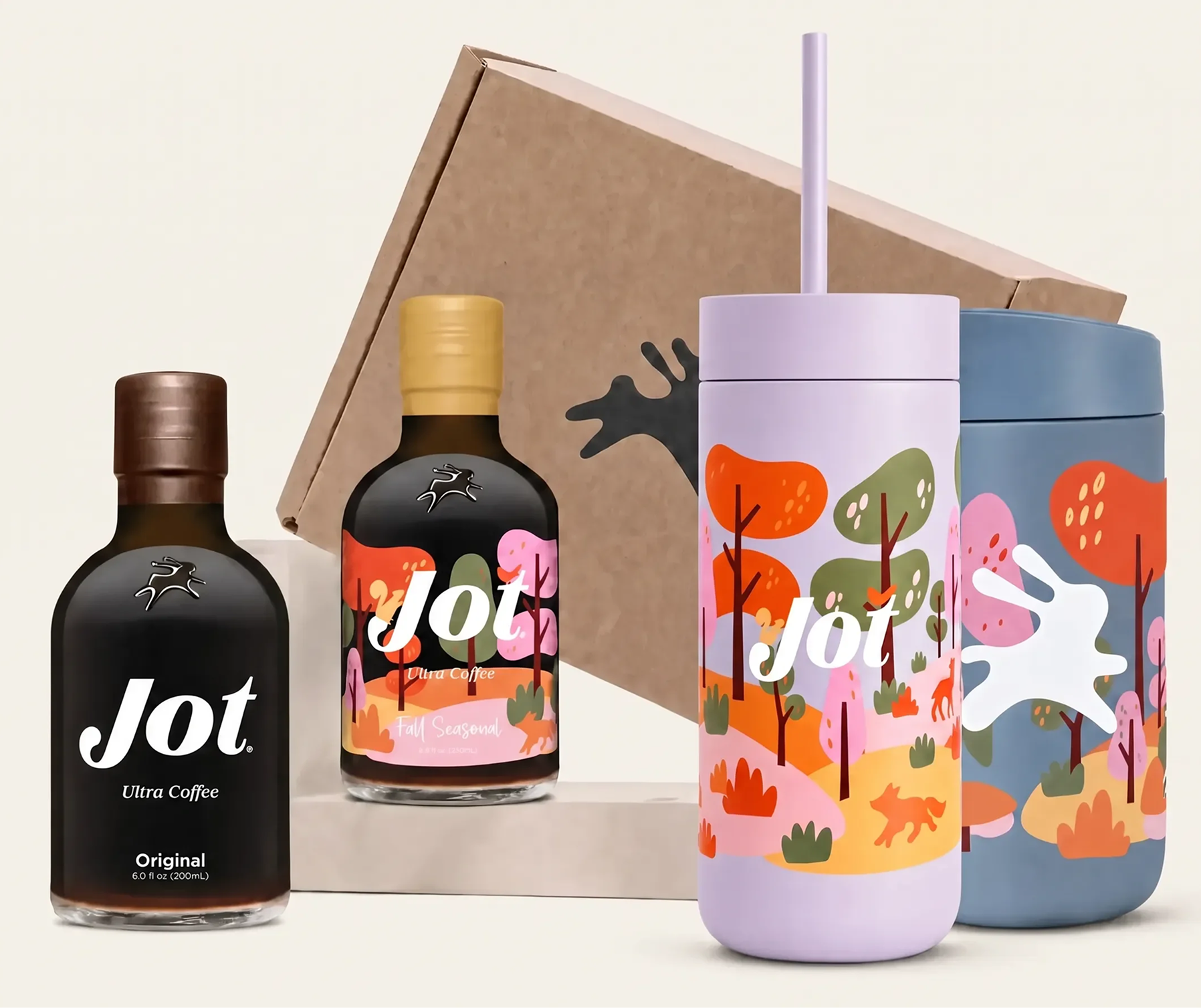 Two bottles of Jot Ultra Coffee and two colorful tumblers arranged in front of a cardboard box.