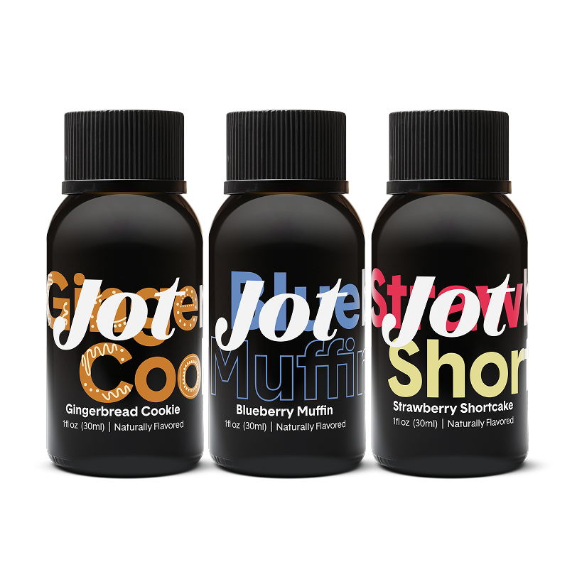 Three dark bottles labeled Gingerbread Cookie, Blueberry Muffin, Strawberry Shortcake flavors.