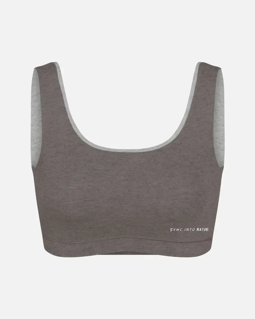 Gray sports bra with 'SYNC INTO NATURE' text on the front.