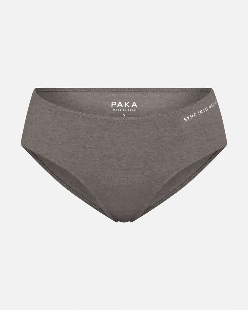 Gray underwear with 'PAKA' and 'SYNC INTO NATURE' text on waistband.