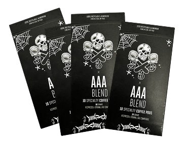 Four black coffee pod packages with skull and crossbones design.