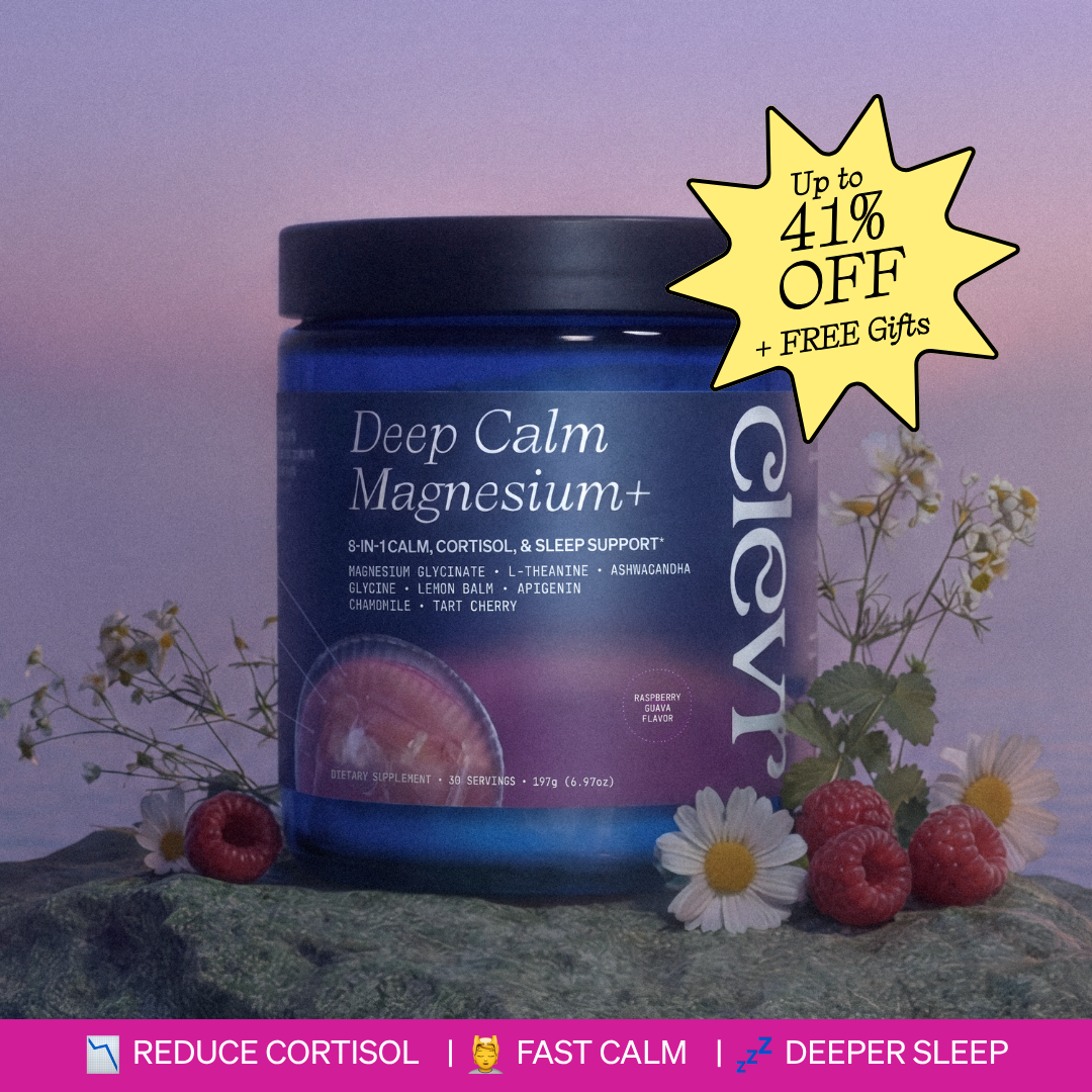 A blue jar of Deep Calm Magnesium+ supplement sits on a rock with raspberries and chamomile flowers.