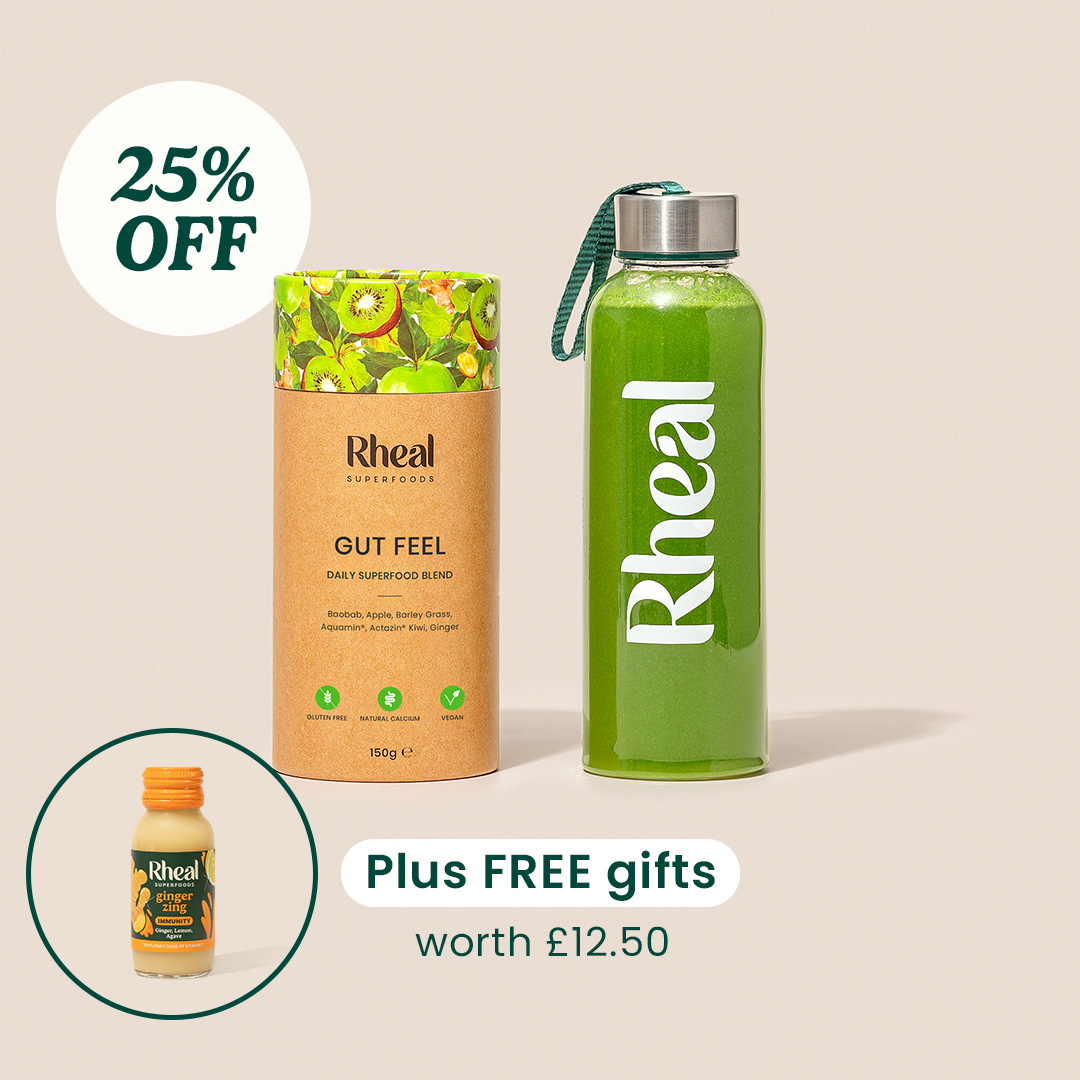 Superfood blend packaging, green bottle, and discount offer displayed against a light background.