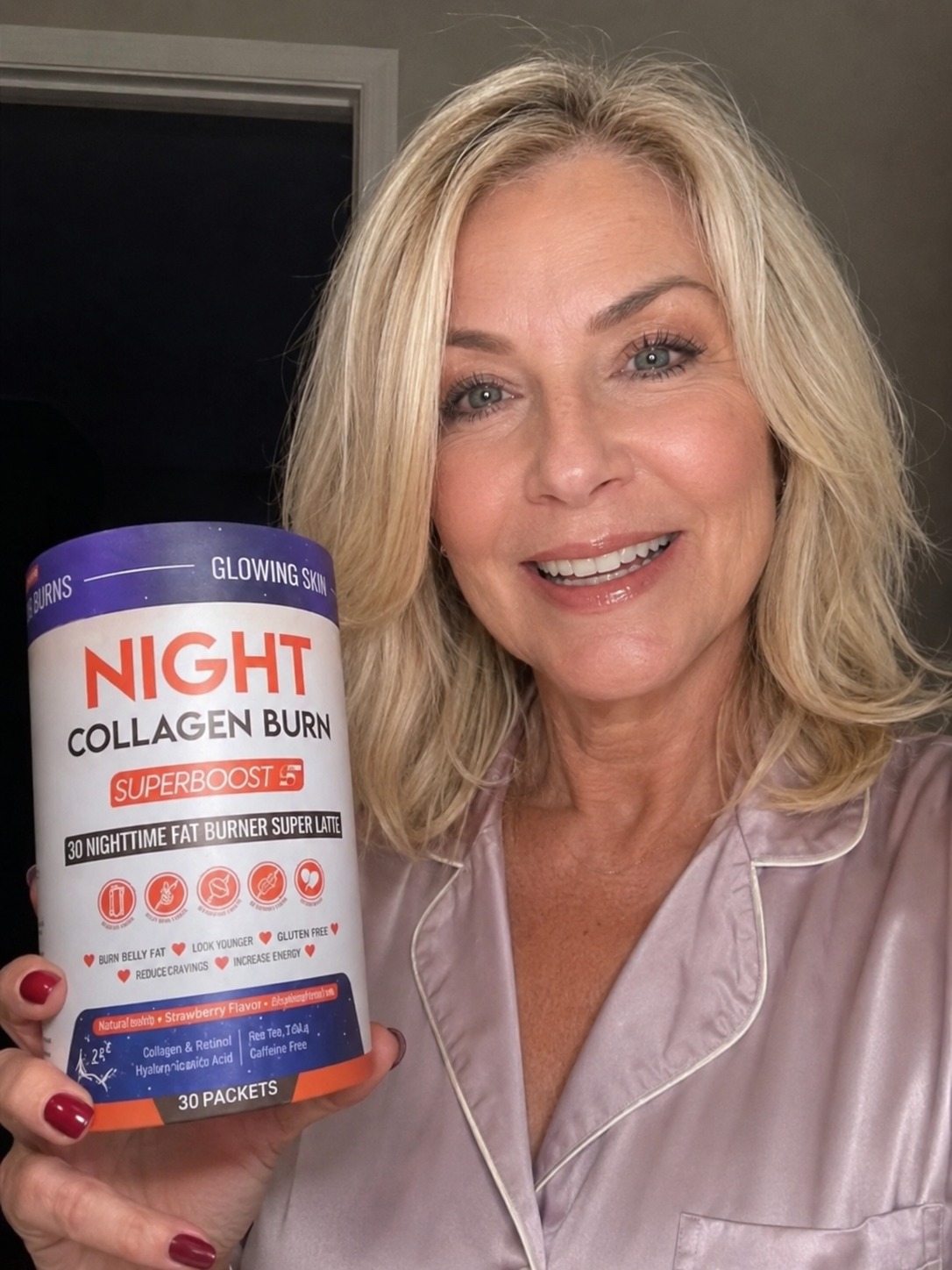 A smiling blonde woman in pink pajamas holds up a container of Night Collagen Burn Superboost supplement.