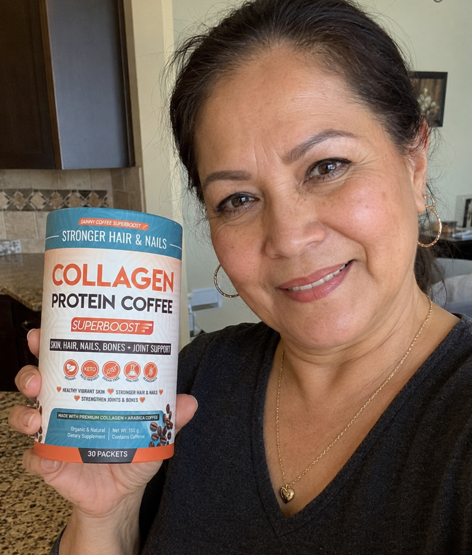 Red-haired girl smiling in her kitchen with Collagen Protein Coffee in hand