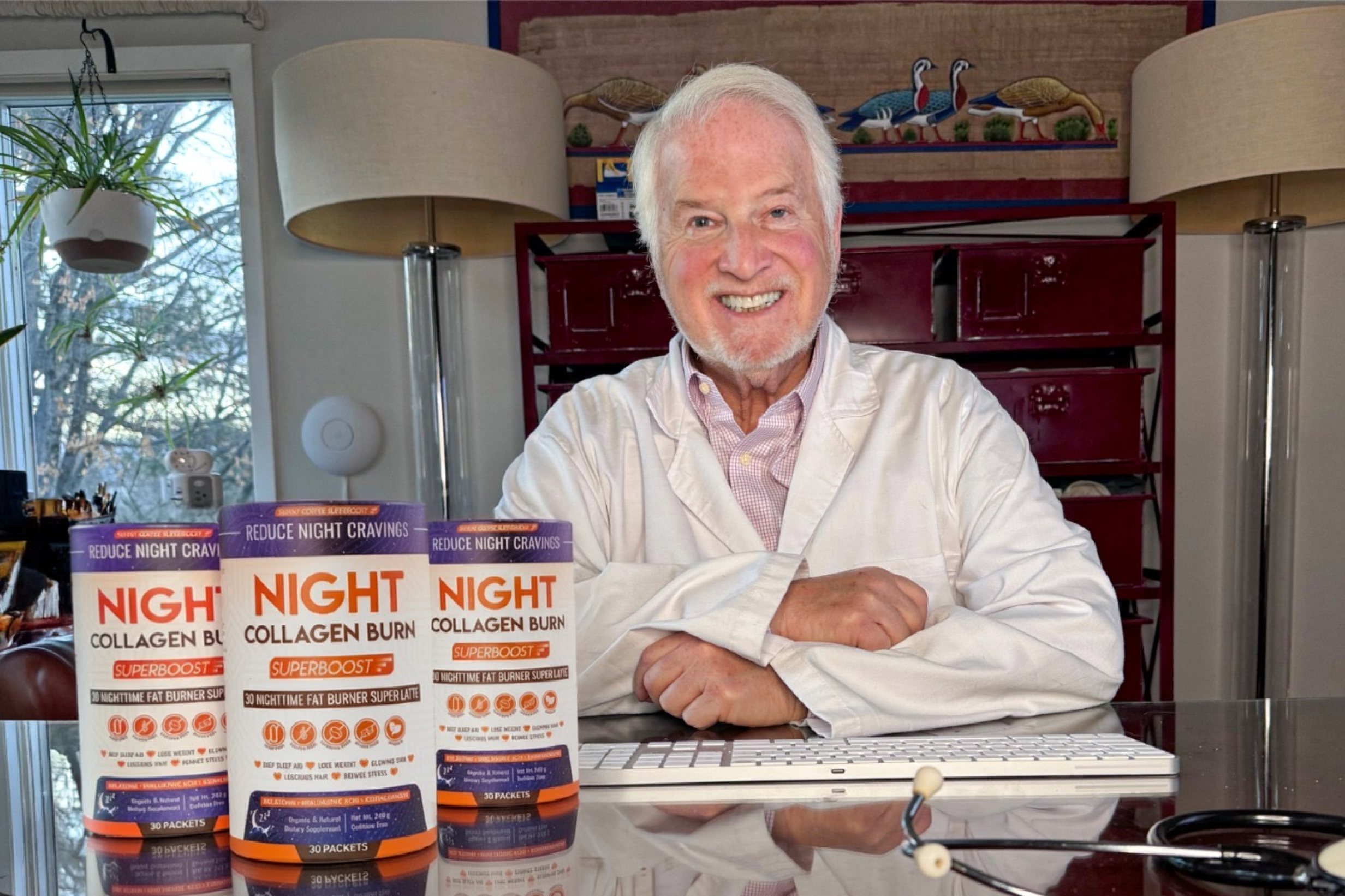 Man in white coat with collagen supplement products on desk.