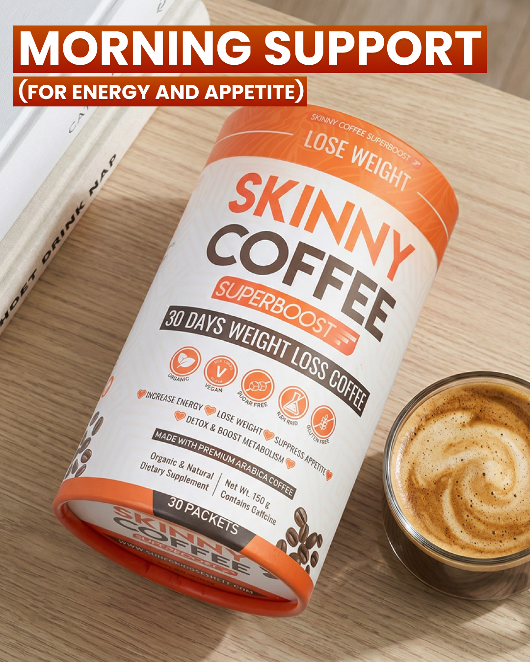 A container of Skinny Coffee Superboost next to a frothy cup of coffee on a wooden surface.