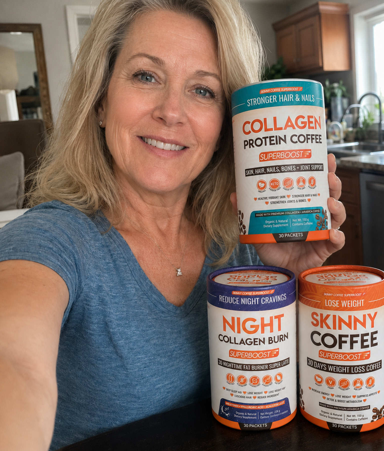 A smiling woman holds a container of Superboost Collagen Protein Coffee with two other Superboost products on a table.