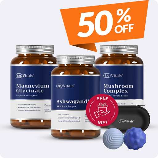 Three supplement bottles with 50% off sign and two massage balls.