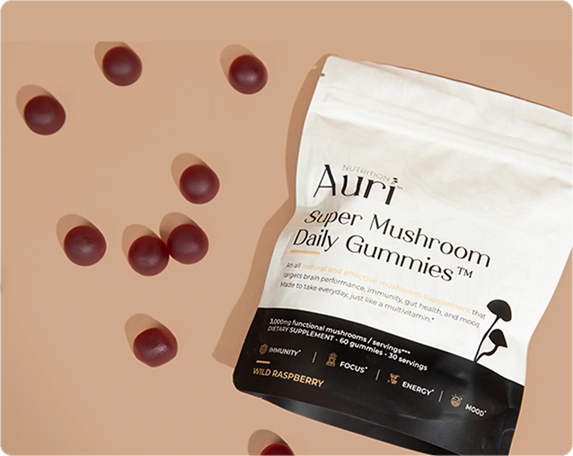Bag of mushroom daily gummies with scattered red gummies on a beige background.