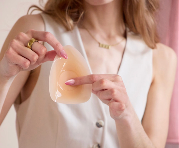 Person holding a translucent silicone pad.
