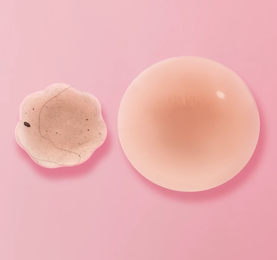 Two silicone skincare items on a pink background.