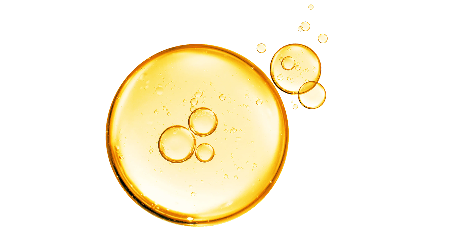 Close-up of golden oil bubbles on a white background.