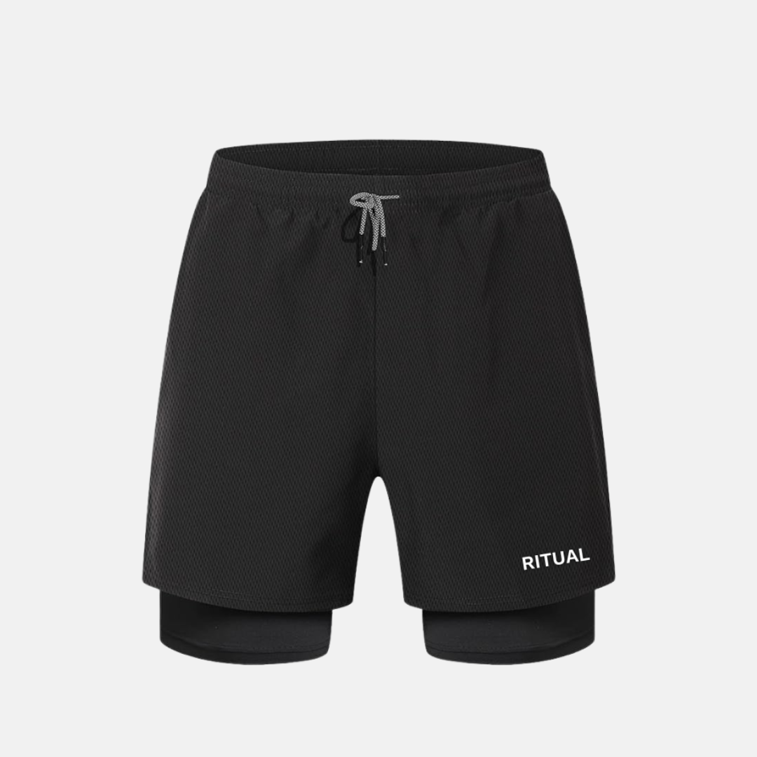 Black shorts with 'RITUAL' branding and drawstring waistband.