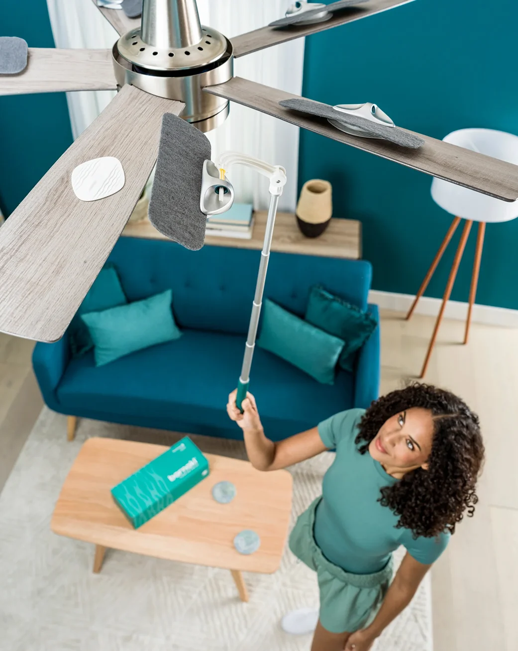 A graphic showing an air purifier cleaning a dusty bedroom by pulling in swirling air particles.