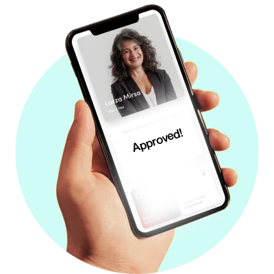 Hand holding a smartphone displaying a woman's photo and the word 'Approved!'
