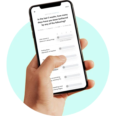 Hand holding a smartphone displaying a survey with sliders.