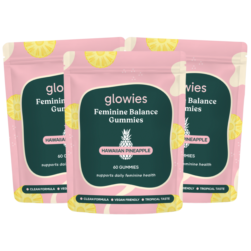 Three pink packages of Glowies Feminine Balance Gummies.