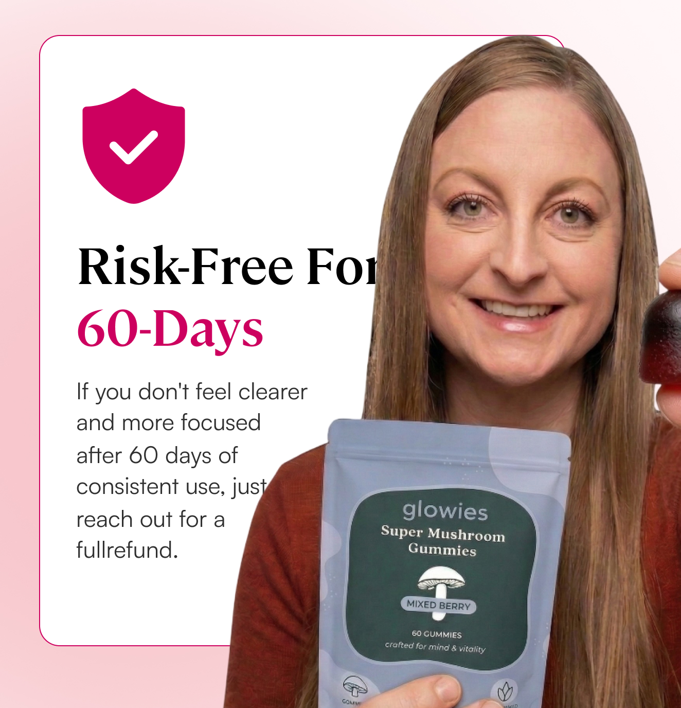 A smiling woman holds a pouch of Glowies Super Mushroom Gummies and one gummy.