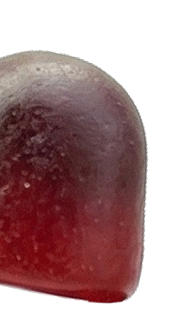 A close-up of a single reddish-purple fruit snack on a white background.