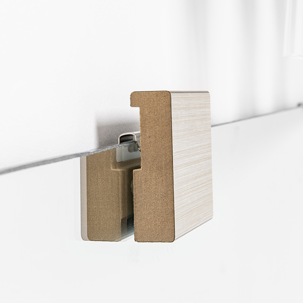Wooden wall panel with a metal bracket attachment.