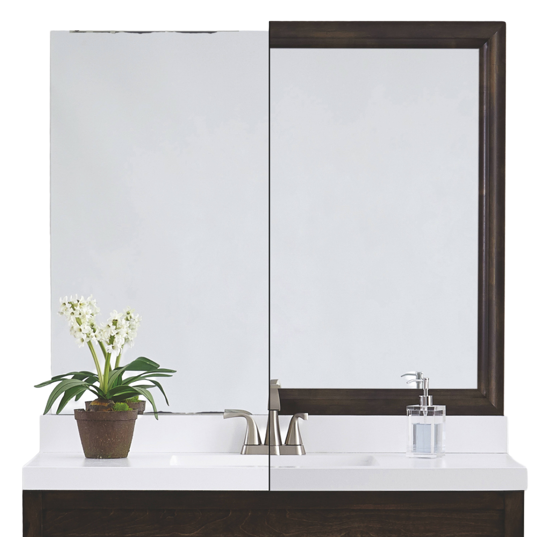 Bathroom vanity with mirror, plant, and soap dispenser.