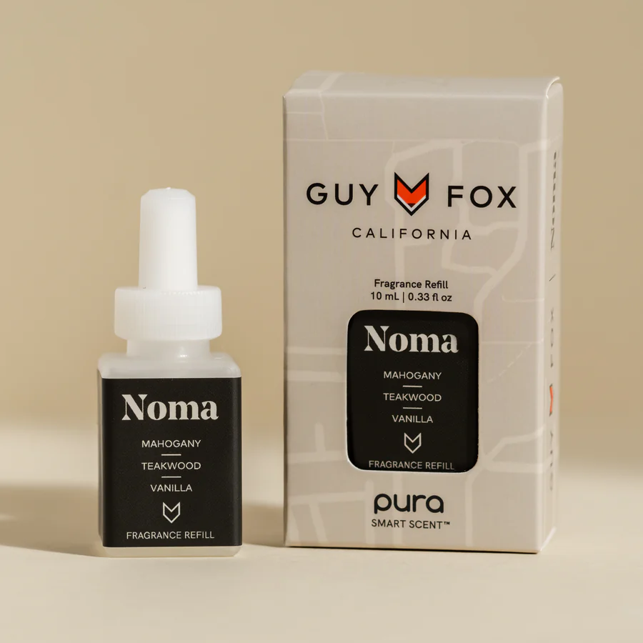 Fragrance refill bottle and box labeled 'Noma' with mahogany, teakwood, vanilla scents.