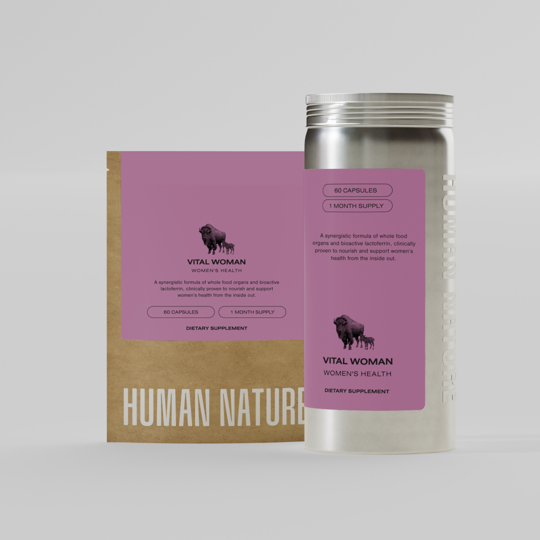 A silver bottle and brown paper pouch for Vital Woman women's health dietary supplement on a plain background.