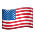 The American flag waves gracefully in the wind against a clear blue sky.
