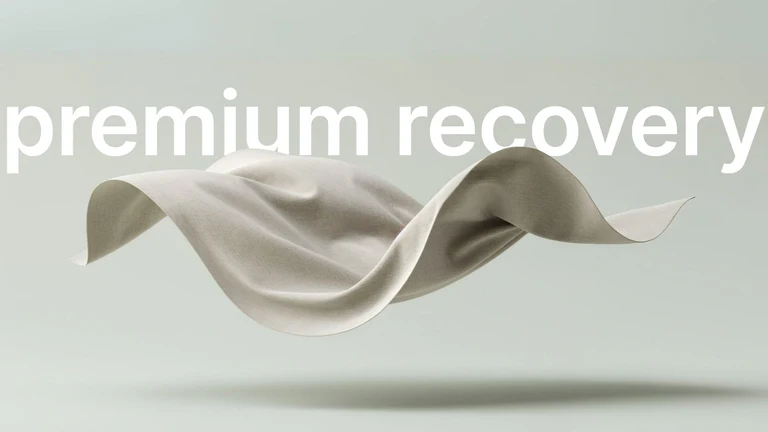 A flowing fabric with the text 'premium recovery' on a light background.