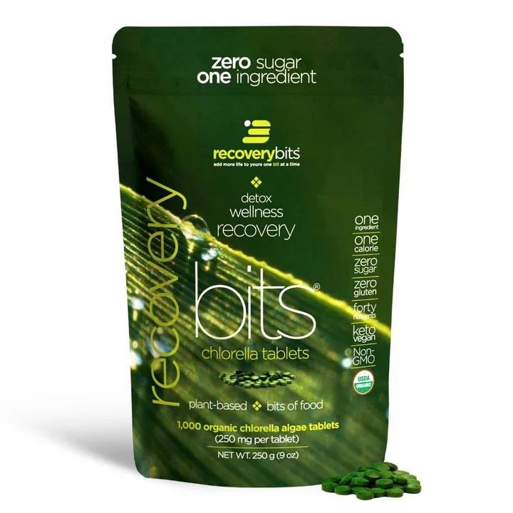Green package of chlorella tablets labeled 'recovery bits' with product details.