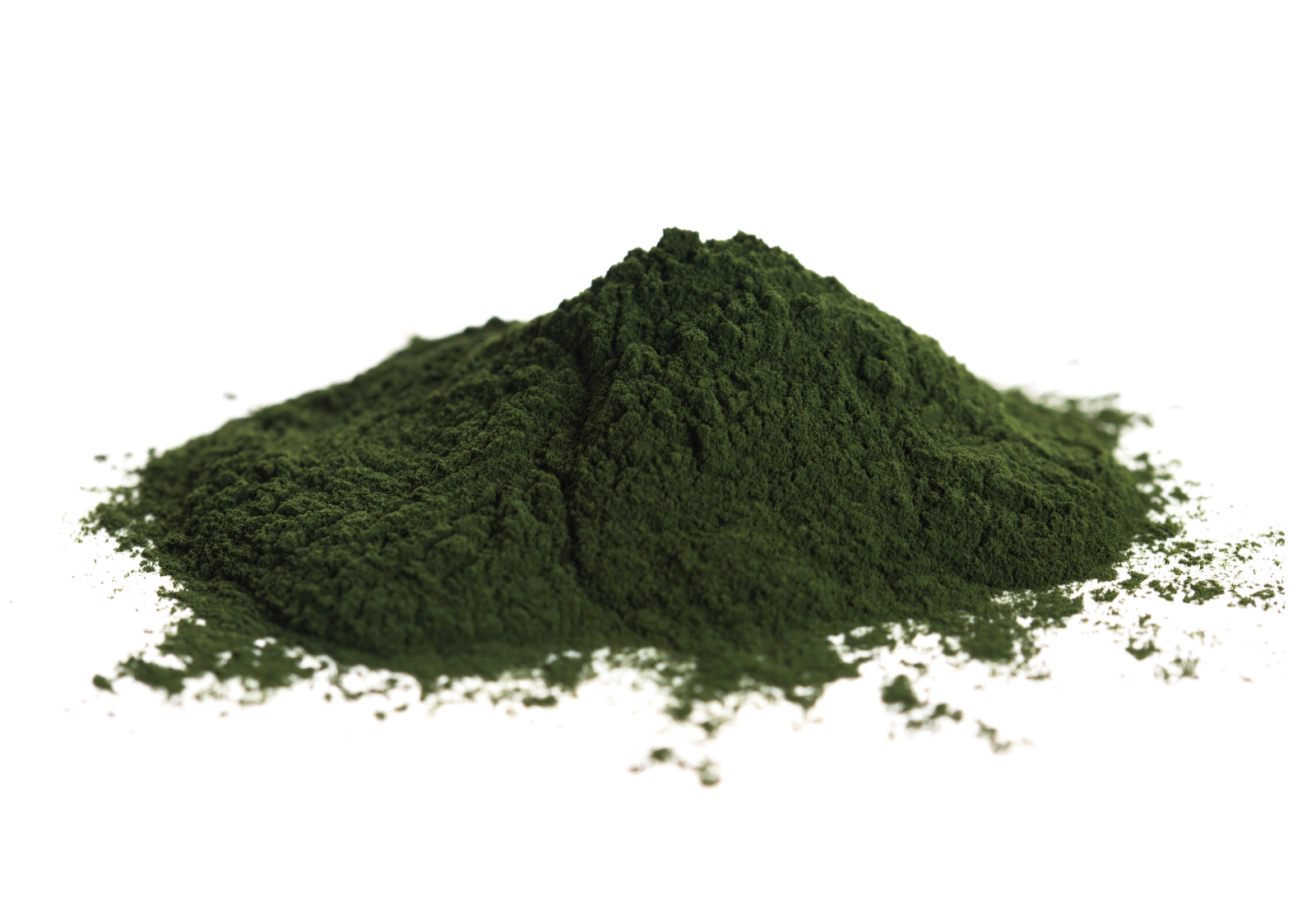A pile of dark green powder on a white background.