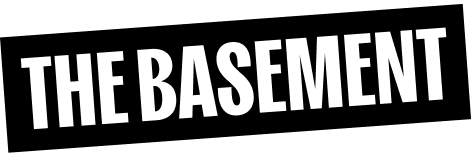 The words 'THE BASEMENT' in a bold, white, angled font on a black background.