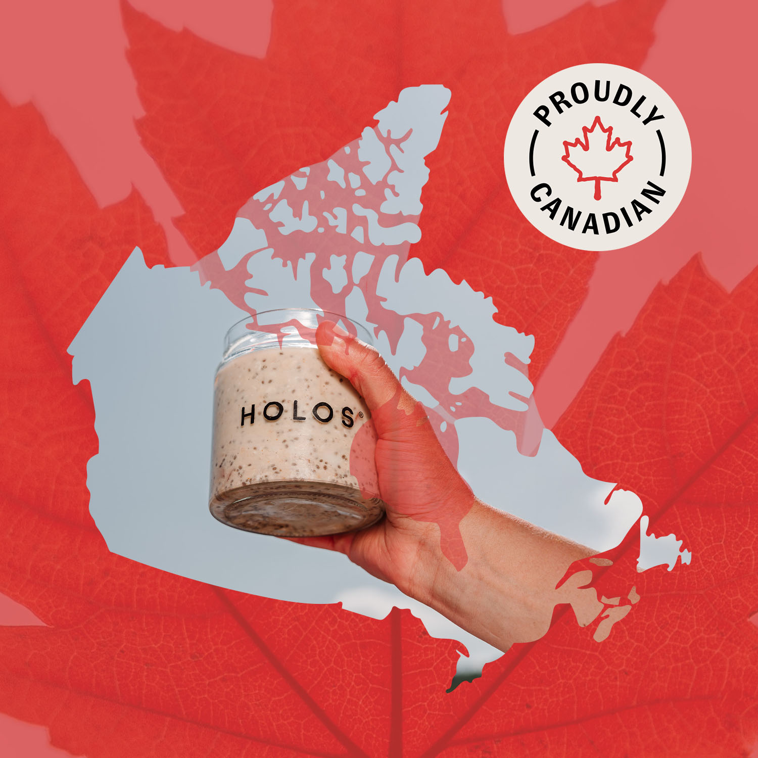 Hand holding a jar labeled 'HOLOS' against a red Canadian map and maple leaf background.