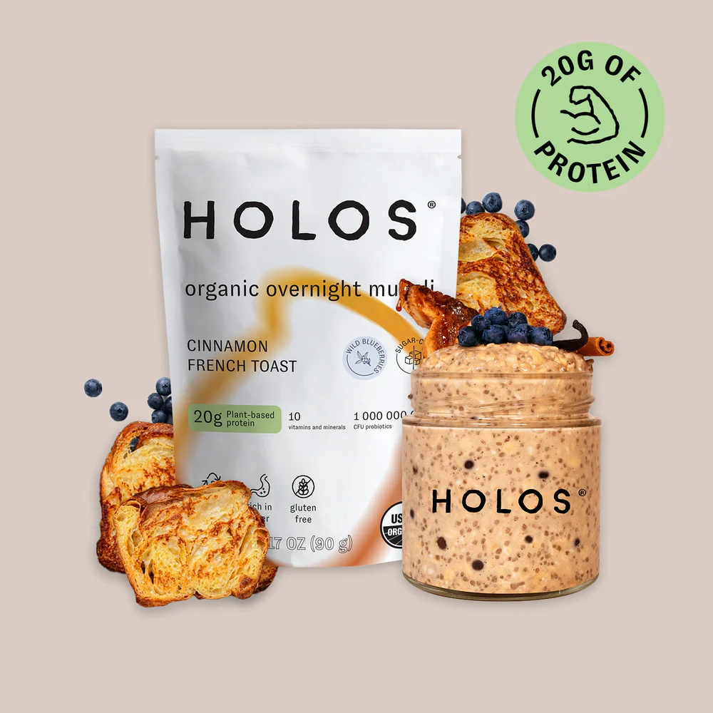 HOLOS organic muesli packet and jar with cinnamon toast and blueberries, 20g protein badge.