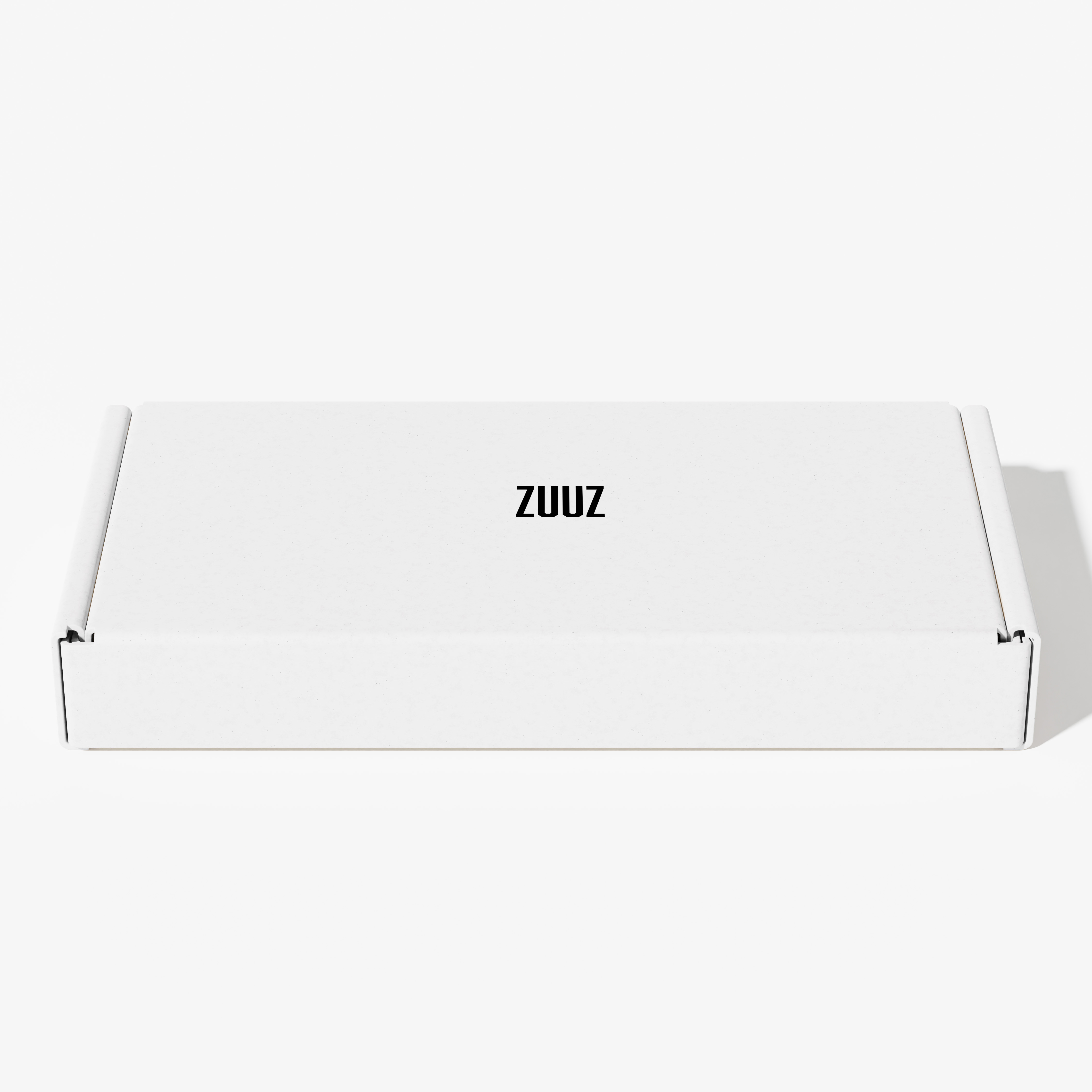 White cardboard box with 'ZUUZ' printed on top.