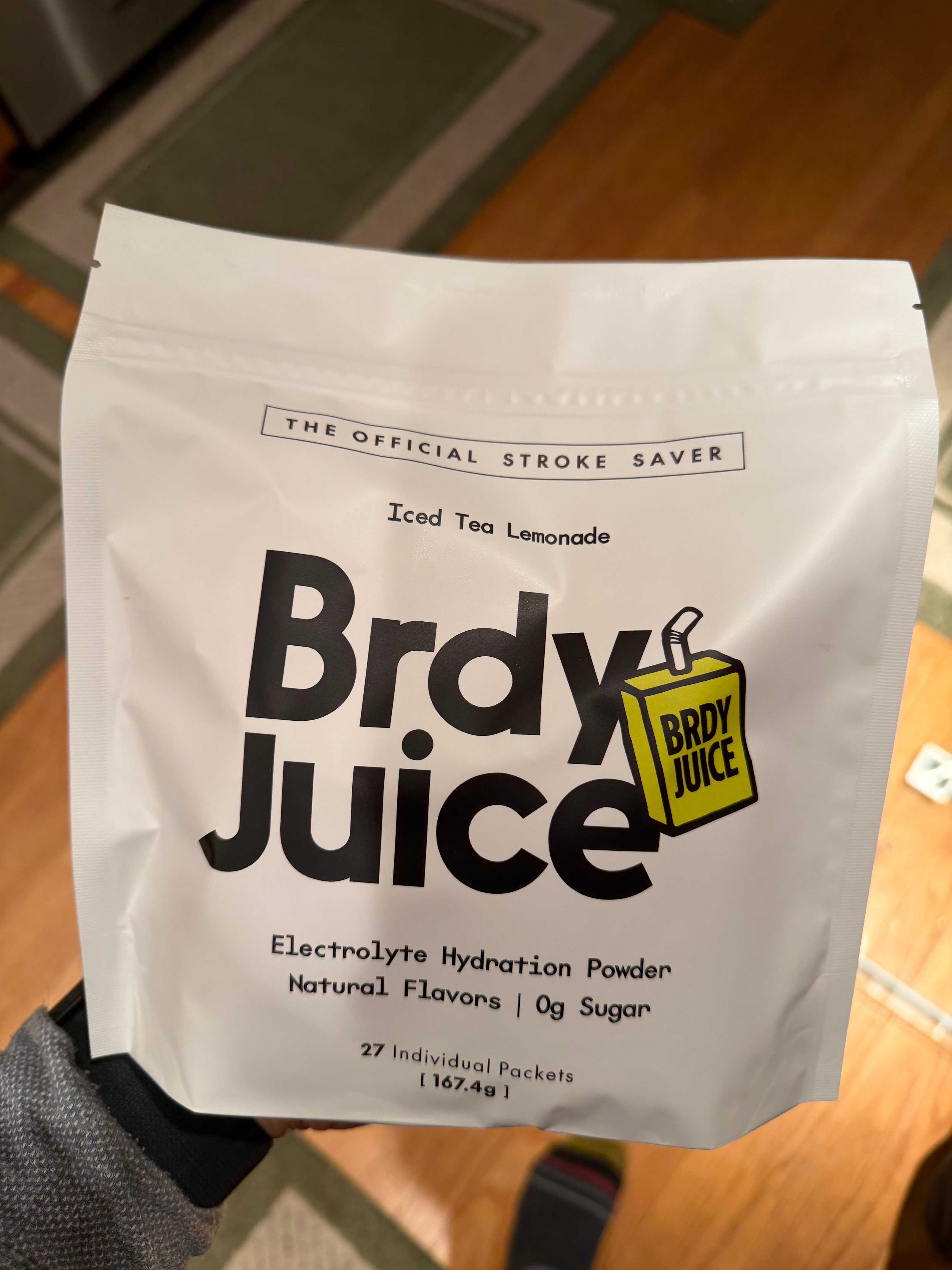 White package labeled 'Brdy Juice' electrolyte hydration powder with 27 packets.